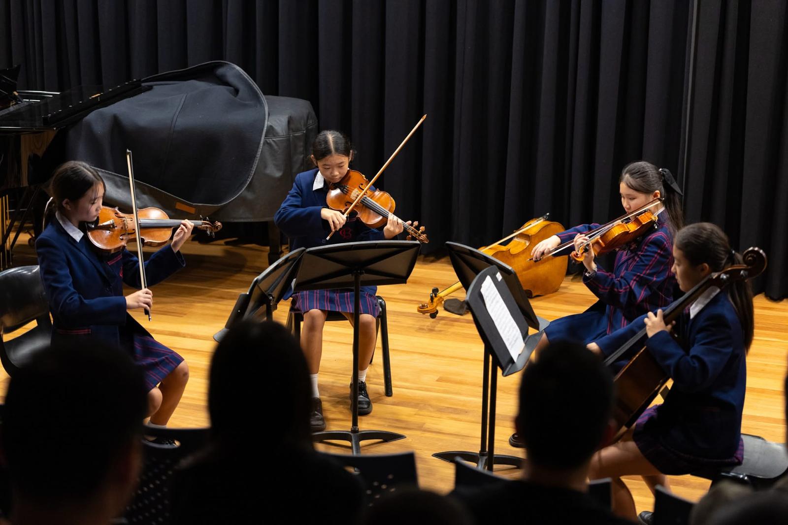 Young string quartet performing